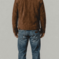 Regular fit men's dark brown suede outerwear displaying clean side welt pockets and adjustable button cuffs for a tailored profile.