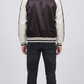 Regular fit men's monochrome varsity jacket displaying clean white-trimmed side slash pockets and a sporty tailored profile.