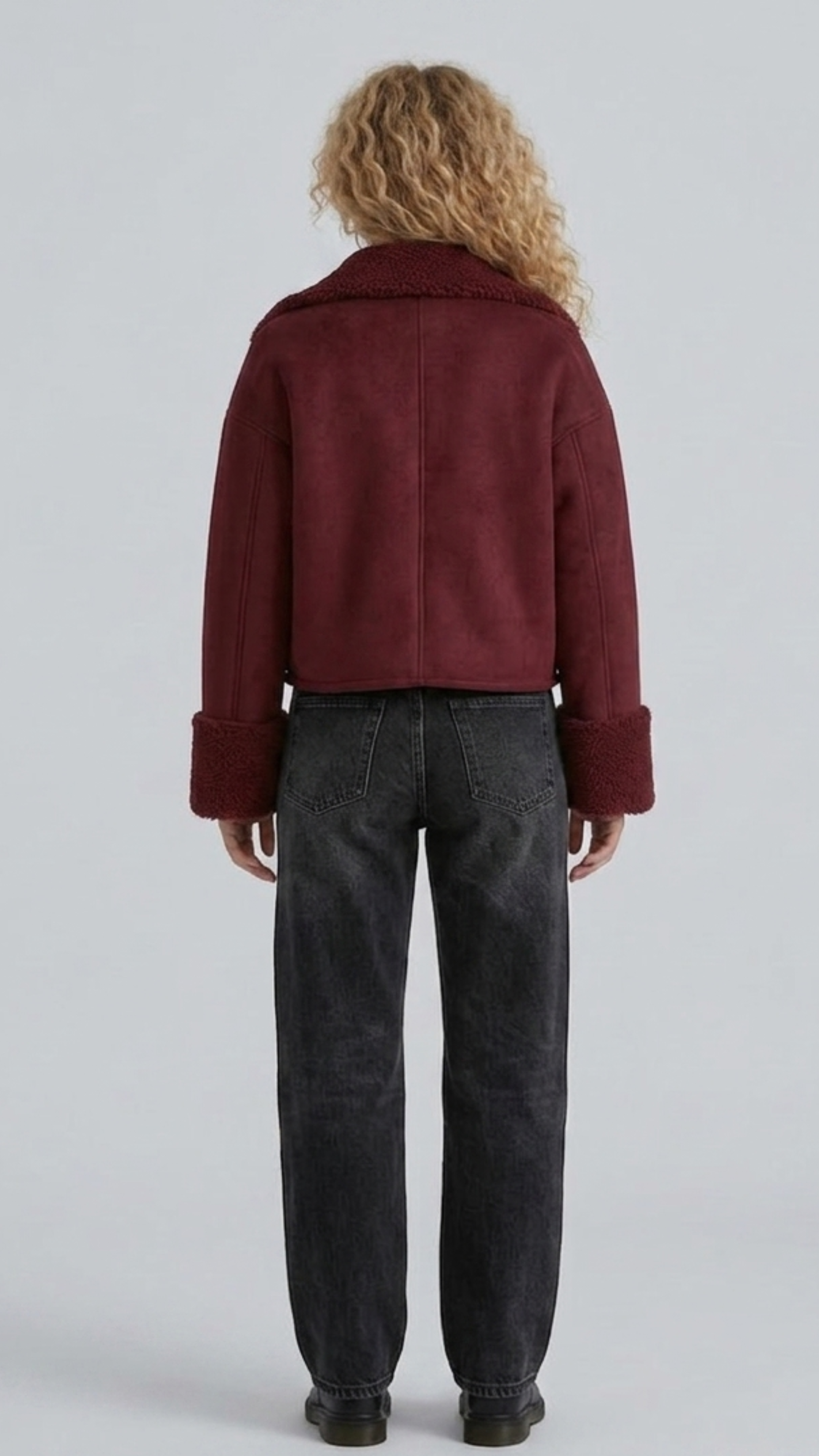 Straight-on back view of the dark maroon suede aviator flight jacket highlighting premium structured stitching and tailored fit shoulders on grey backdrop.