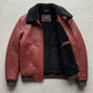 Flat lay setup featuring the premium cognac brown leather bomber jacket styled flat for online catalog merchandising.
