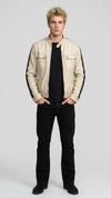 minimalist panel structure and pristine cream leather profile of the luxury racer coat.