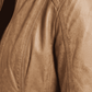 Detailed close-up showing the smooth texture and light tan dye of premium genuine leather, complemented by sleek metallic zippers.