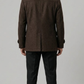 Regular fit men's chocolate brown wool jacket with deep side welt pockets, offering both utility and a modern clean profile.