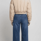Regular fit women's off-white short line outerwear displaying clean tailored seams, side alignment, and a streamlined boxy silhouette.