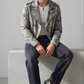 Streetwear fashion lookbook featuring a premium off-white black vintage leather jacket on a light grey background.