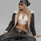 Contemporary urban fashion presentation featuring a baggy dark brown leather jacket lined with cozy shearling, styled for a rich winter look.