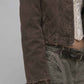 Close-up shot of the plush fur collar attached to dark khaki rugged denim fabric weave