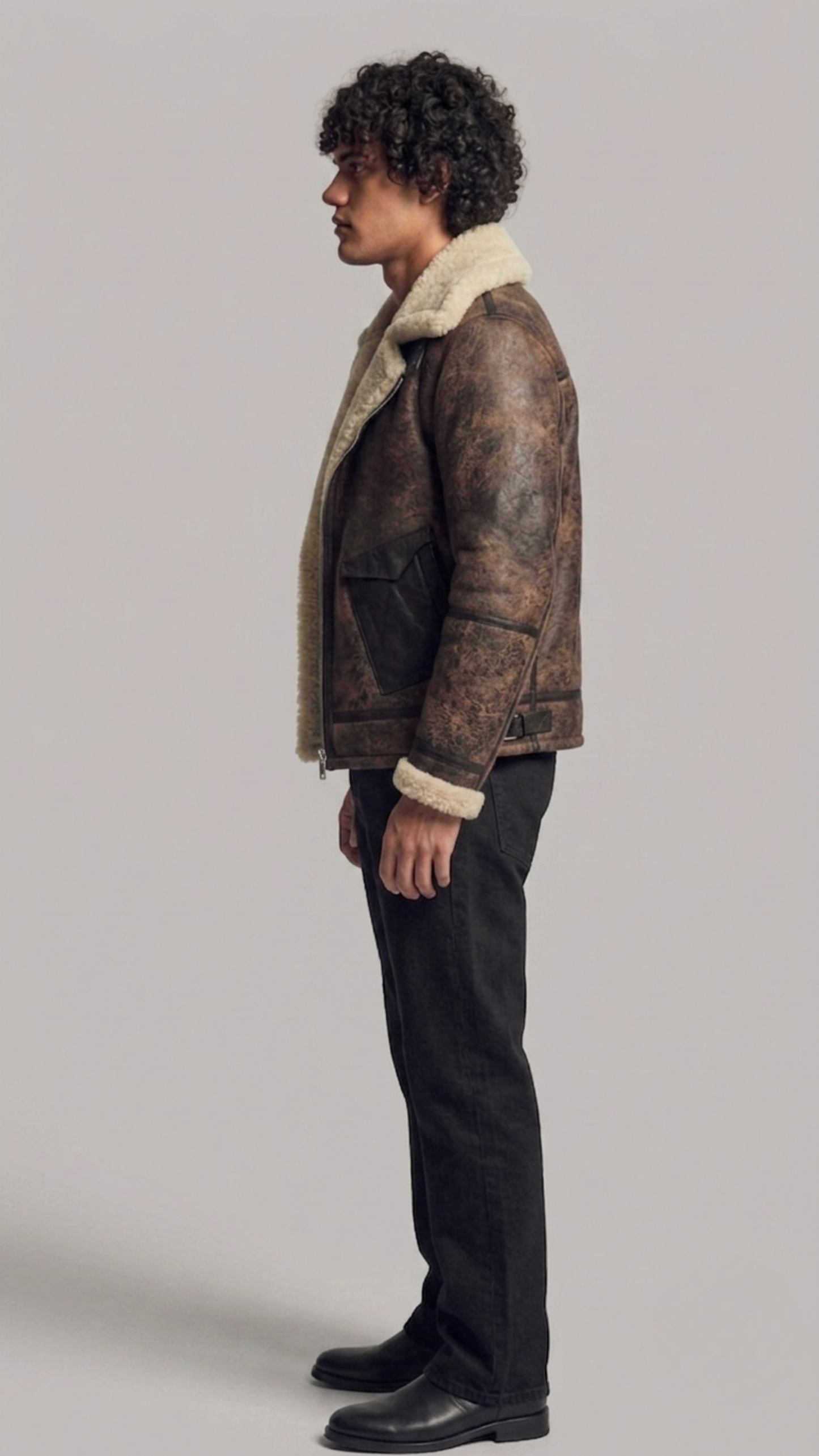 Men's vintage-style dark brown aviator leather coat with a warm cream fur lining.