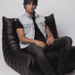Men's contemporary casual fashion showcasing a stylish light blue jean waistcoat layered effortlessly over a plain white t-shirt.