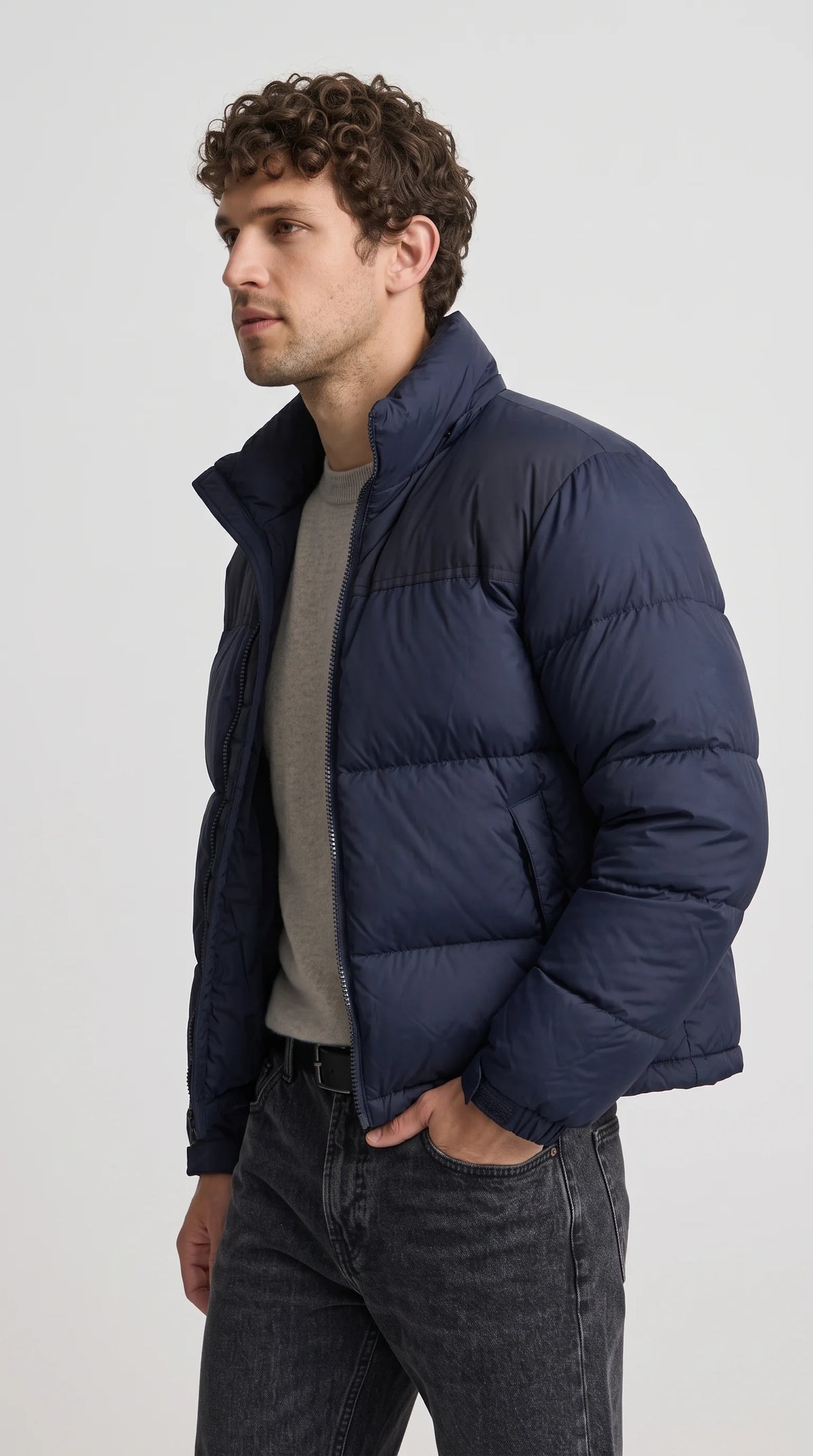 The ultimate winter wardrobe staple by Jackero, featuring a highly sought-after dark navy blue quilted jacket that seamlessly merges cozy functionality with aggressive modern street style.
