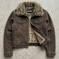 Flat lay display of Jackero dark khaki Y2K denim jacket showing plush fur collar and clean interior lining