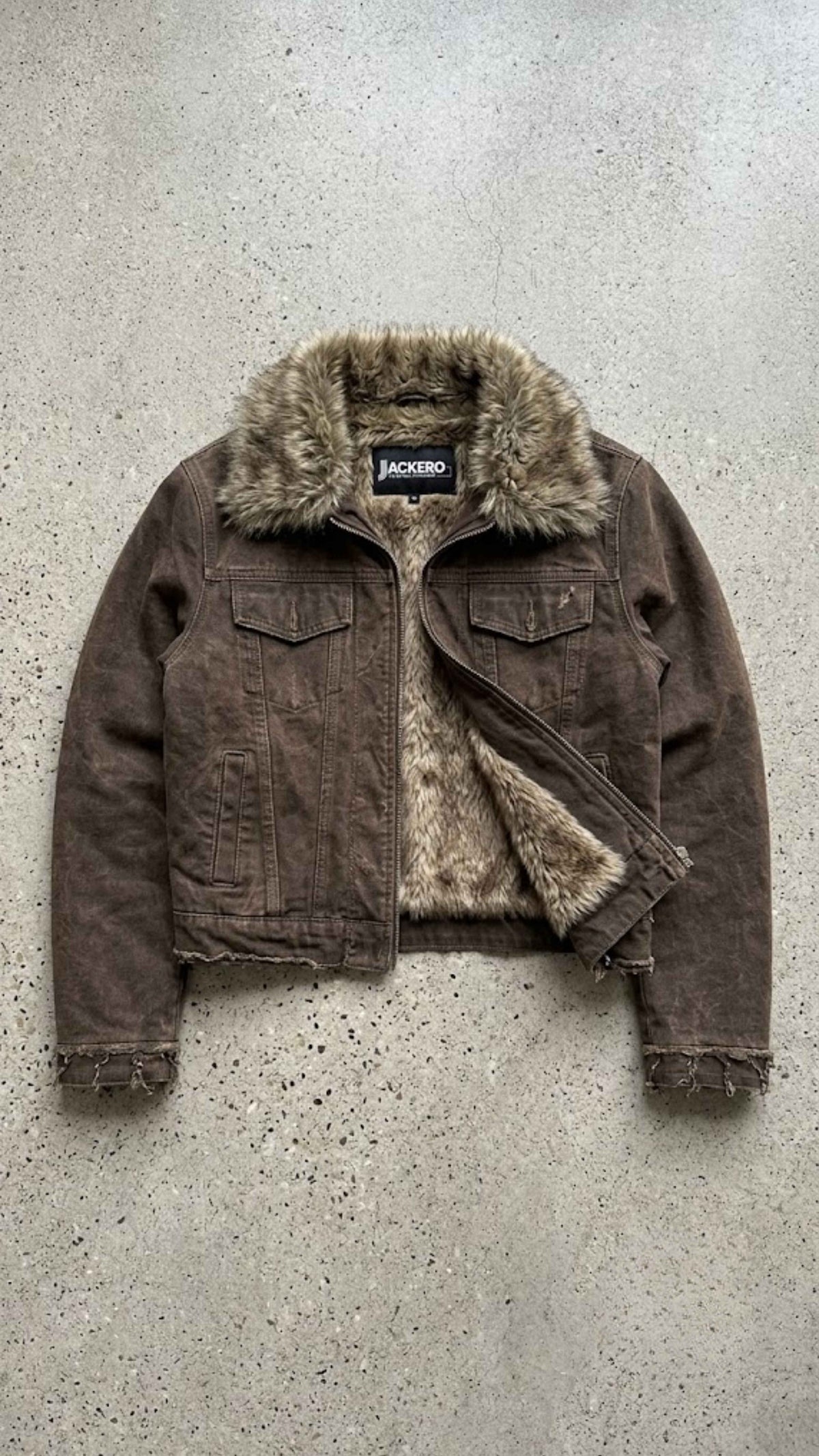Flat lay display of Jackero dark khaki Y2K denim jacket showing plush fur collar and clean interior lining