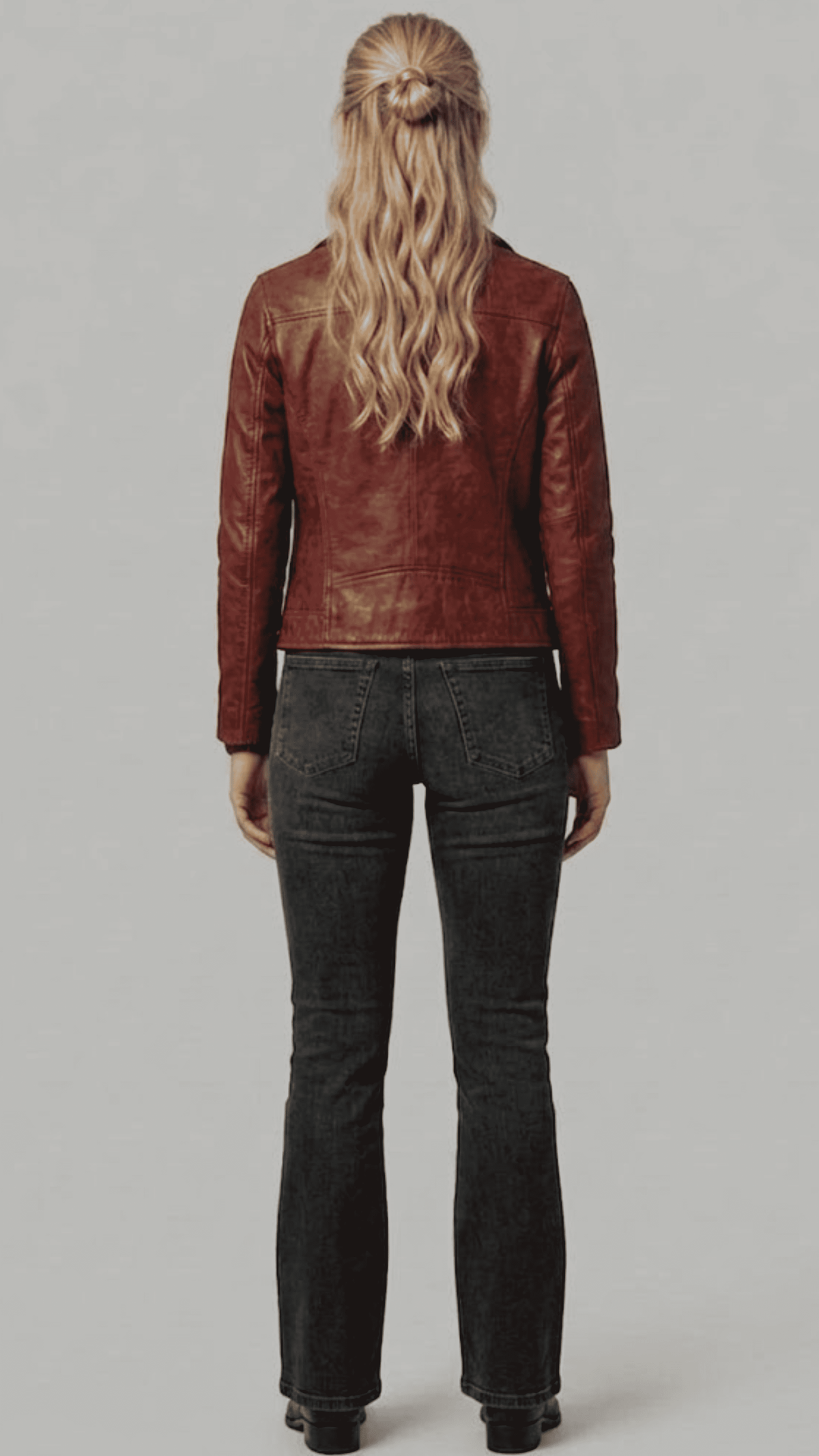 Symmetrical back perspective of a structured dark red leather biker coat, showcasing clean seam lines and a sleek tailored finish.