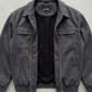 Flat lay studio photography of Jackero premium dark grey suede outerwear