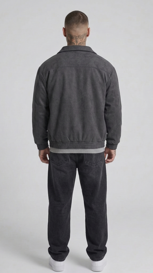 a minimalist dark grey suede jacket featuring simple cuffs and clean lines