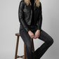 Symmetrical full-body studio photography of a versatile black leather jacket for catalog inventory.