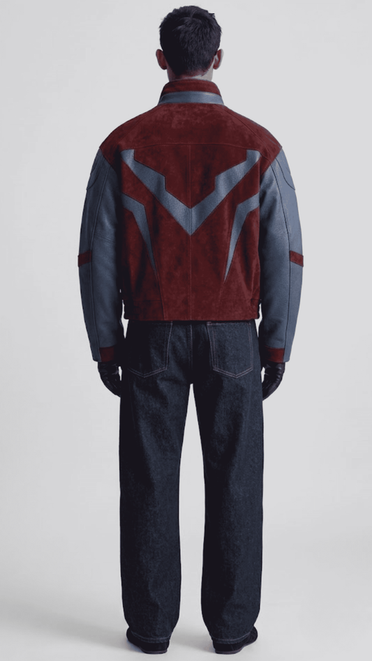 Back view displaying two-tone dark red suede and navy blue leather paneling on oversized silhouette jacket.