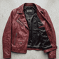 Premium Jackero dark red genuine leather jacket presented on a neutral studio backdrop, highlighting rich color tones and outerwear craftsmanship.