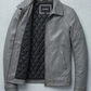 Gray leather jacket with quilted lining on a light gray background