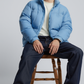 contemporary light blue streetwear puffer jacket paired with casual winter outfits.