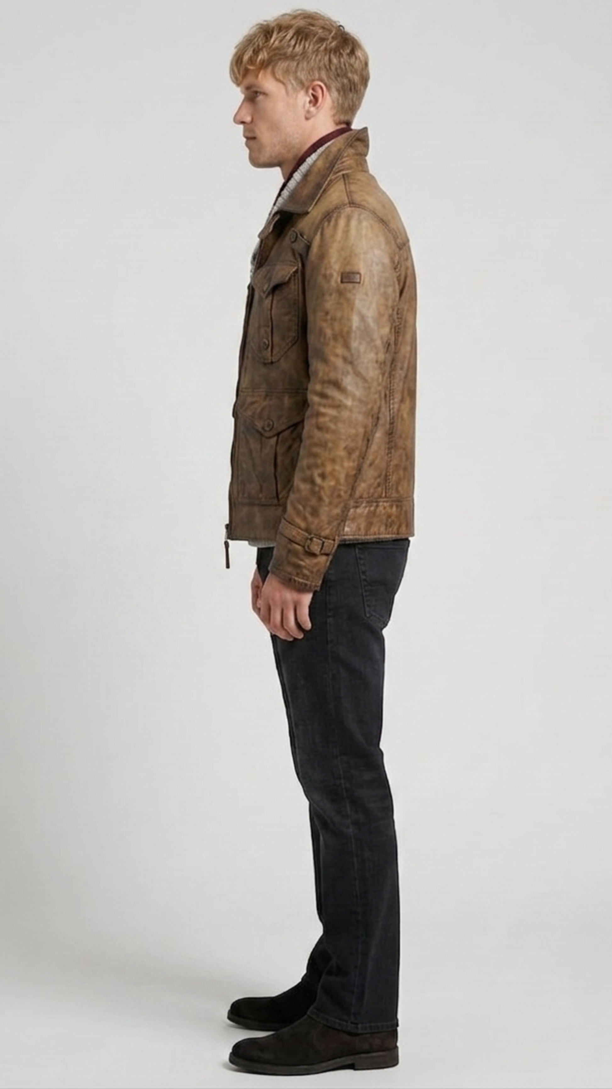 Regular fit men's brown weathered leather utility coat displaying a clean profile, sharp collar, and comfortable waist alignment.