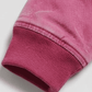 Close-up shot highlighting the ultra-soft velvet texture of light pink suede fabric and durable stitching details.