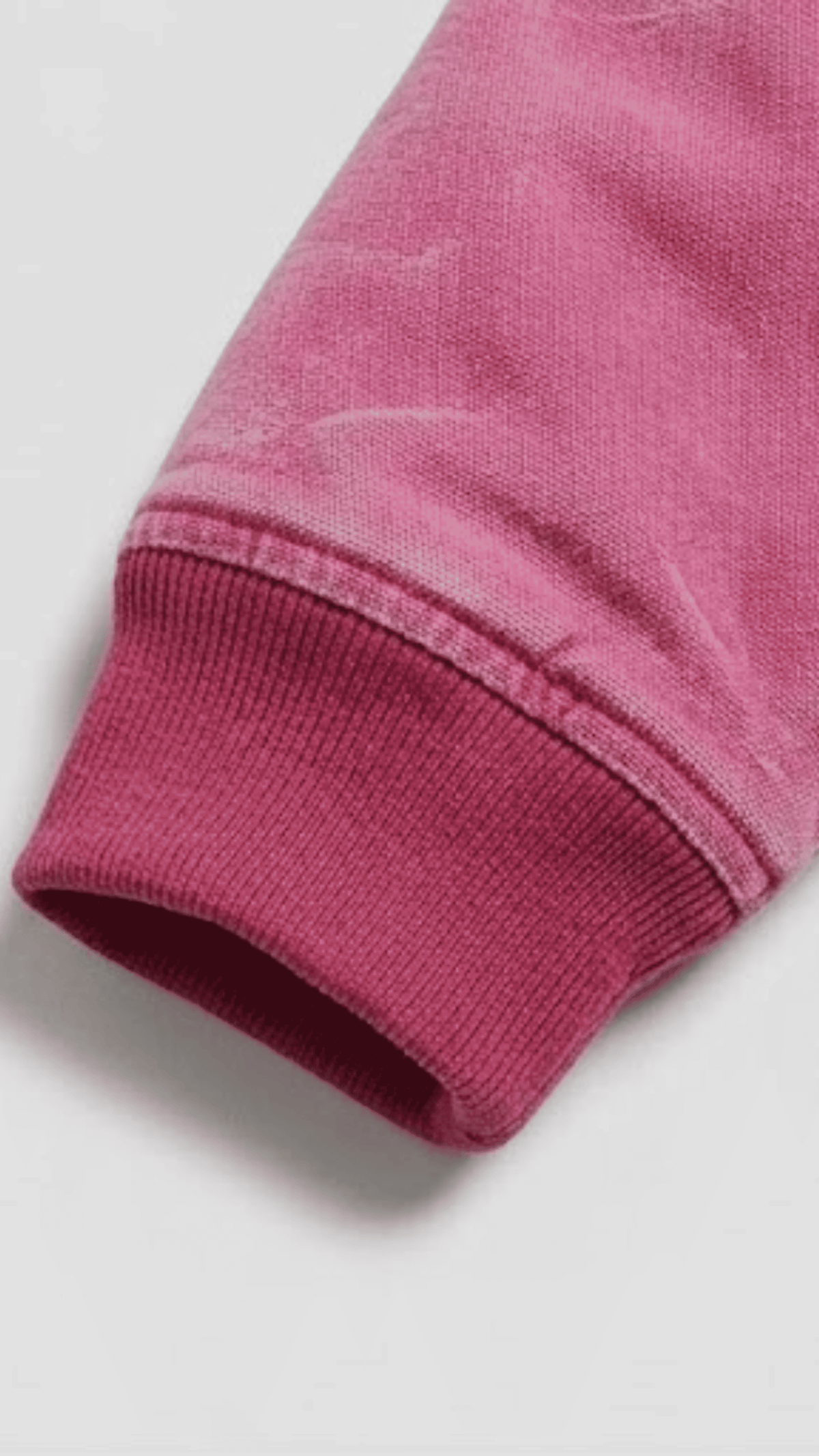 Close-up shot highlighting the ultra-soft velvet texture of light pink suede fabric and durable stitching details.