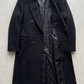 Stylish black double breasted long wool coat winter outerwear featuring classic lapels and double-breasted design.