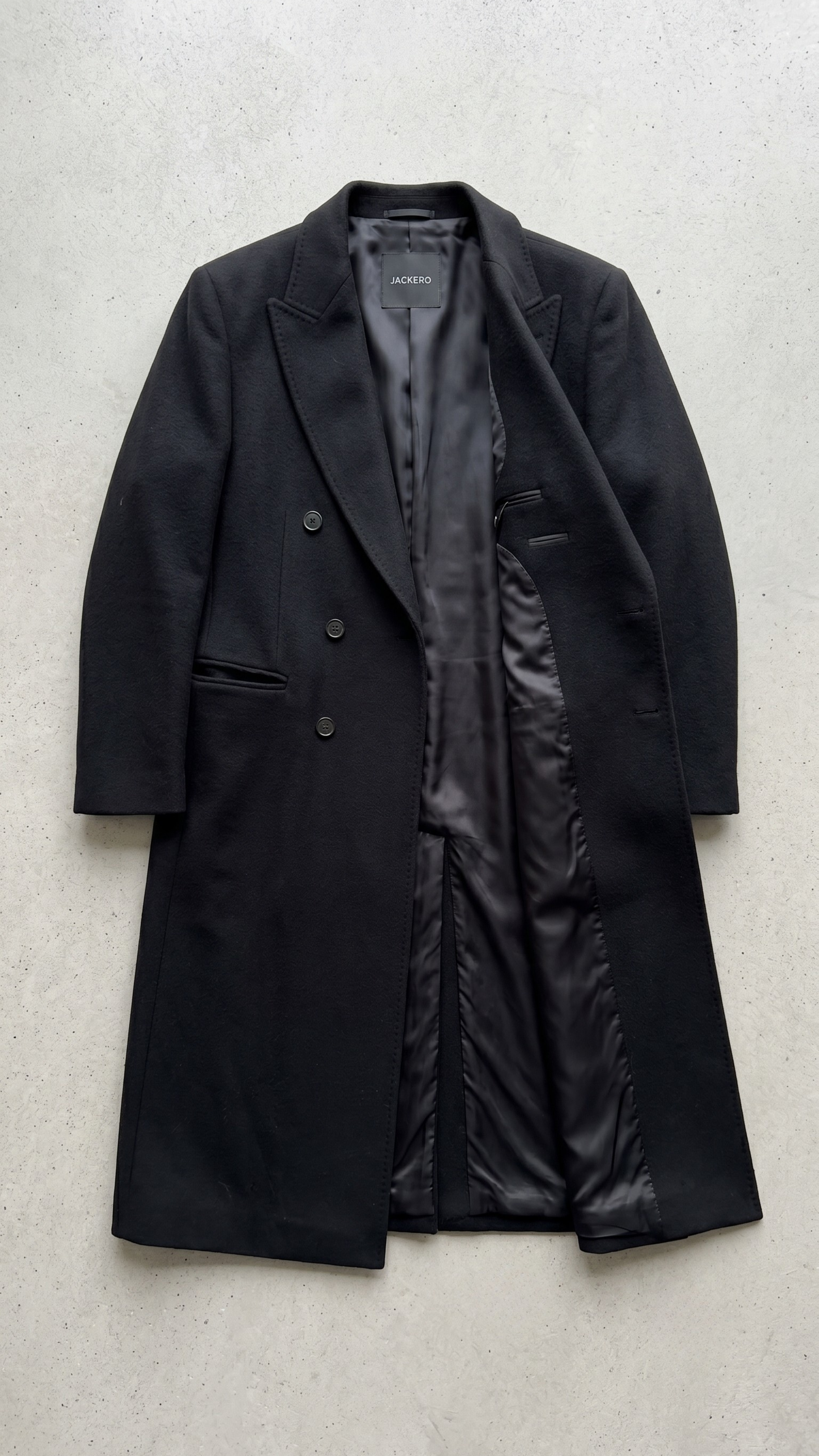 Stylish black double breasted long wool coat winter outerwear featuring classic lapels and double-breasted design.