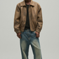 Jackero premium tan leather bomber jacket for men featuring a metallic zipper closure and classic ribbed knit hem.  