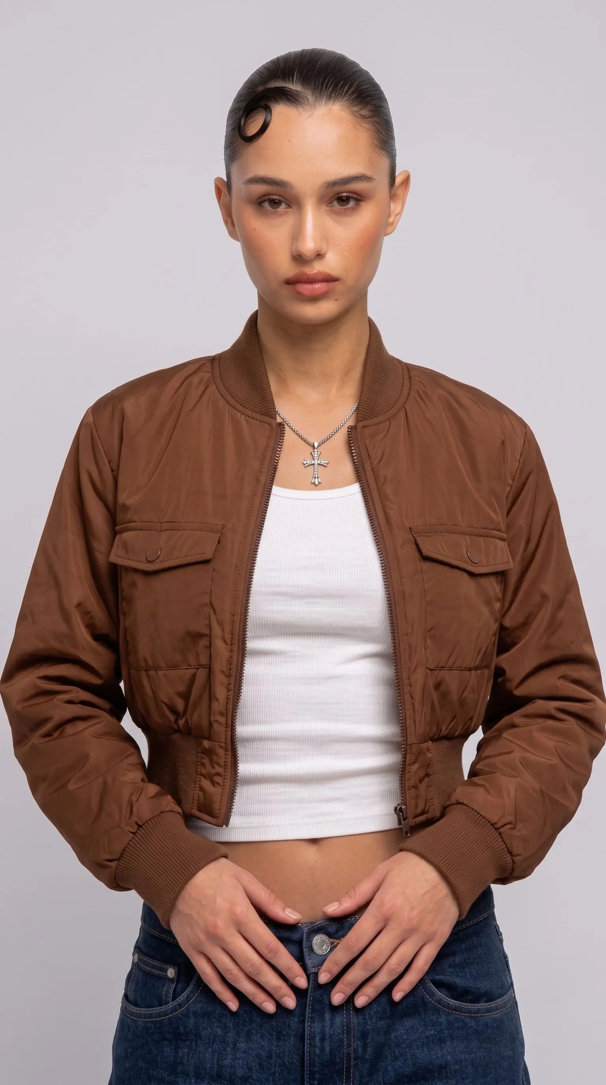 Front full view of premium tan silk cotton jacket highlighting the warm neutral color palette and clean center zipper closure.

