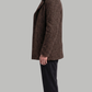 Model wearing a sophisticated dark brown double-breasted long wool coat in a studio.