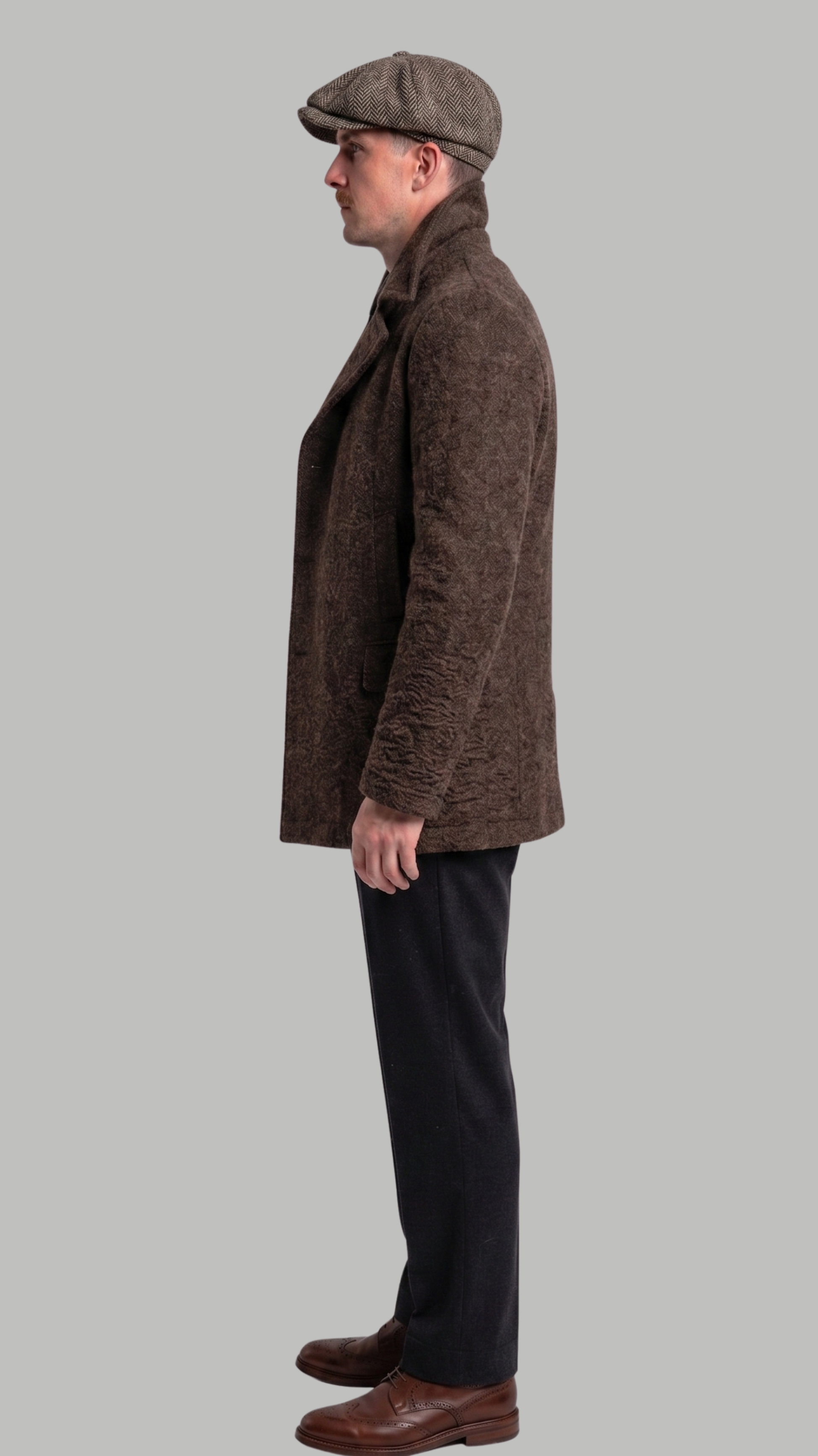 Model wearing a sophisticated dark brown double-breasted long wool coat in a studio.
