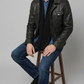 Contemporary lifestyle streetwear look presenting a sleek black leather button-up jacket with functional flap pockets.