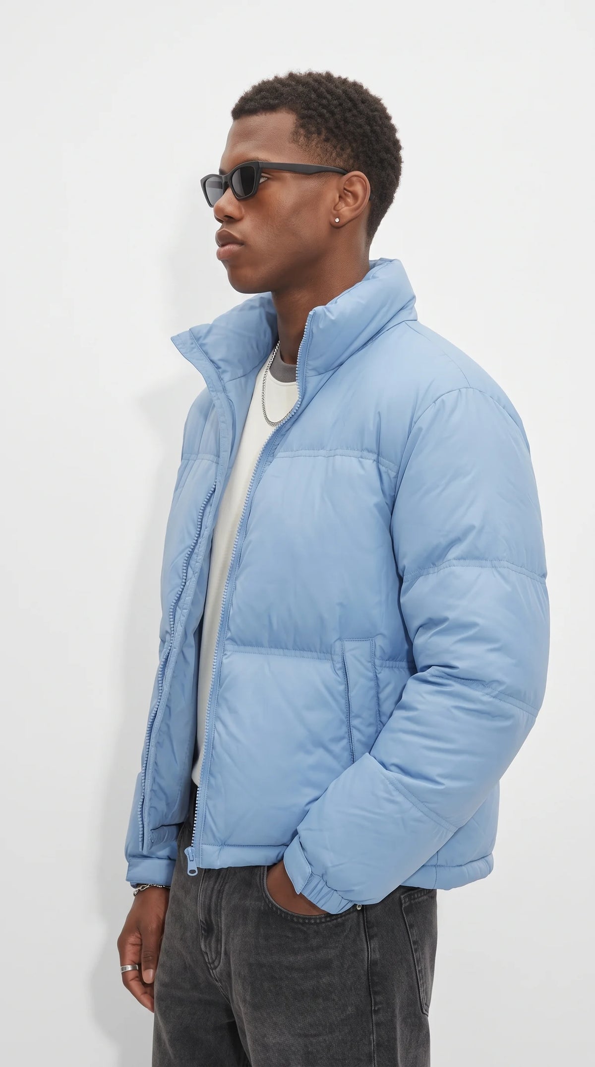 The perfect pop of color for dreary days, the Jackero baby blue winter puffer coat delivers insane coziness alongside a sharp, modern streetwear silhouette.