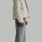 Studio photography of a model in a clean white puffer jacket, perfect for cold winter days.