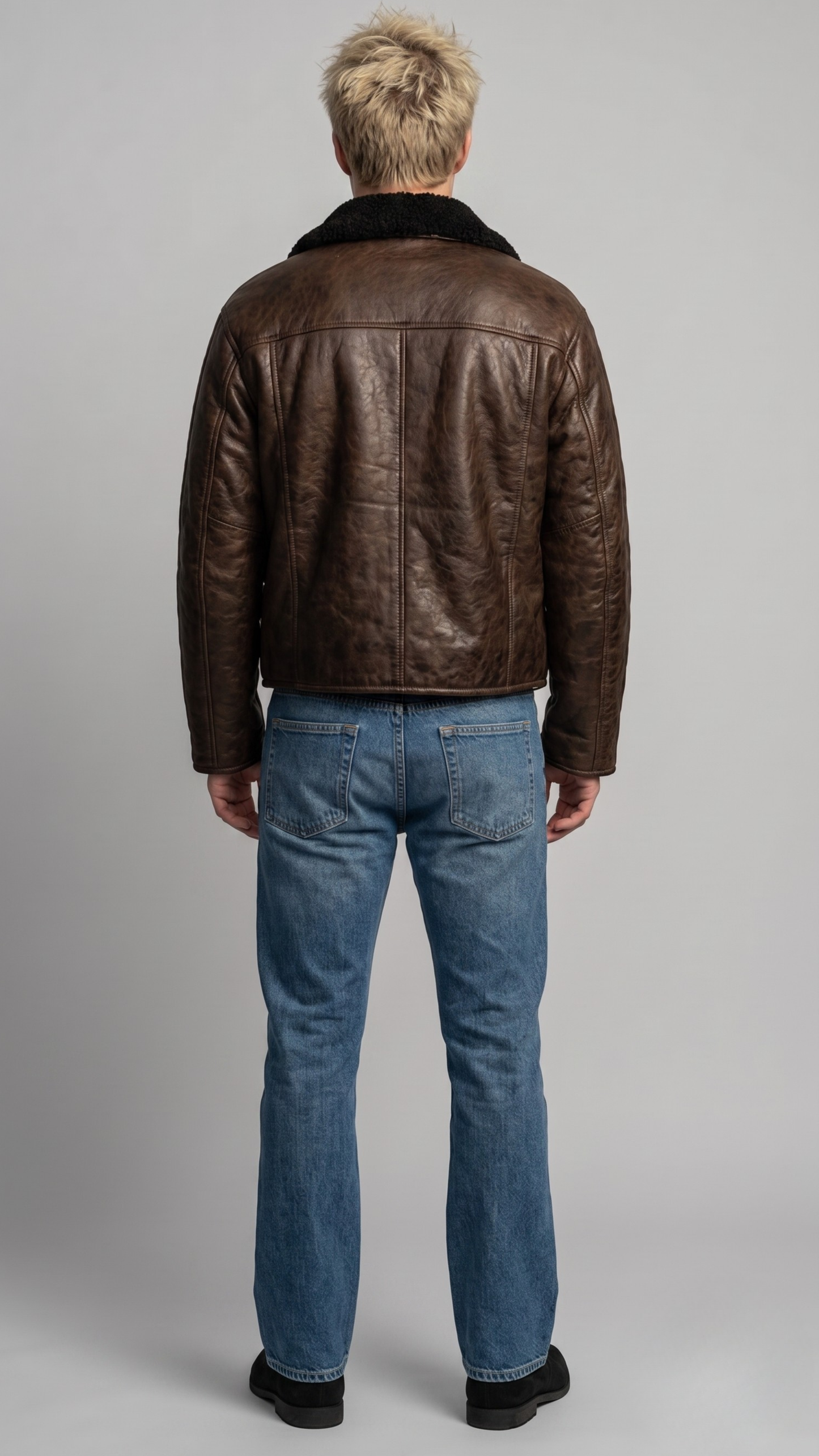Mens classic aviator jacket crafted from rich dark brown leather with a warm, striking black shearling lining.