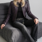 Showcasing a bold seasonal outfit centered around a statement dark plum genuine leather rider coat.