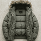 Flat lay presentation of Jackero olive green oversized puffer jacket showing soft inner lining and padded construction