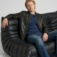 Men's timeless outerwear fashion showcasing a sleek black leather biker jacket styled effortlessly for a sharp look.
