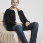 Men's rugged winter fashion featuring a stylish dark chocolate brown suede aviator jacket with warm shearling trim.