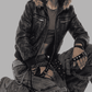 Trendy Y2K vintage fashion presentation featuring a baggy black leather jacket with rich brown fur styled for a 2000s streetwear look.