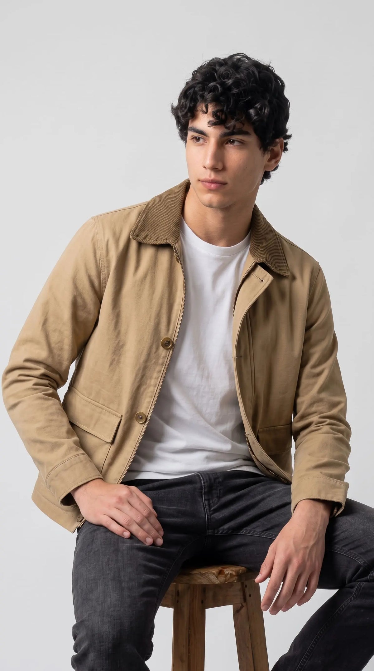 well-tailored beige cotton jacket showcasing symmetrical pockets and a clean fit.
