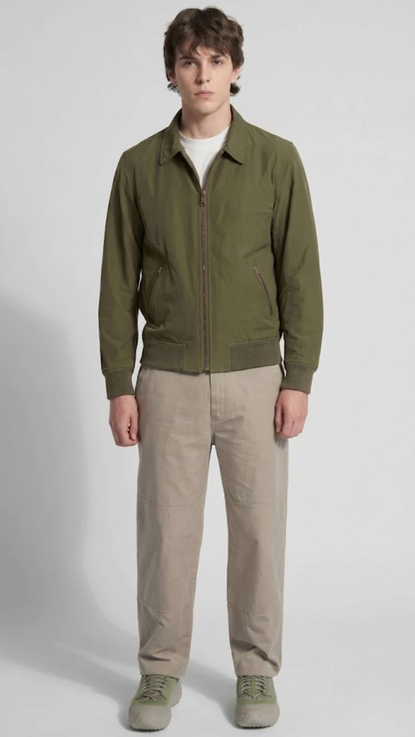 versatile olive green cotton utility jacket featuring a clean silhouette for a modern military-inspired look.
