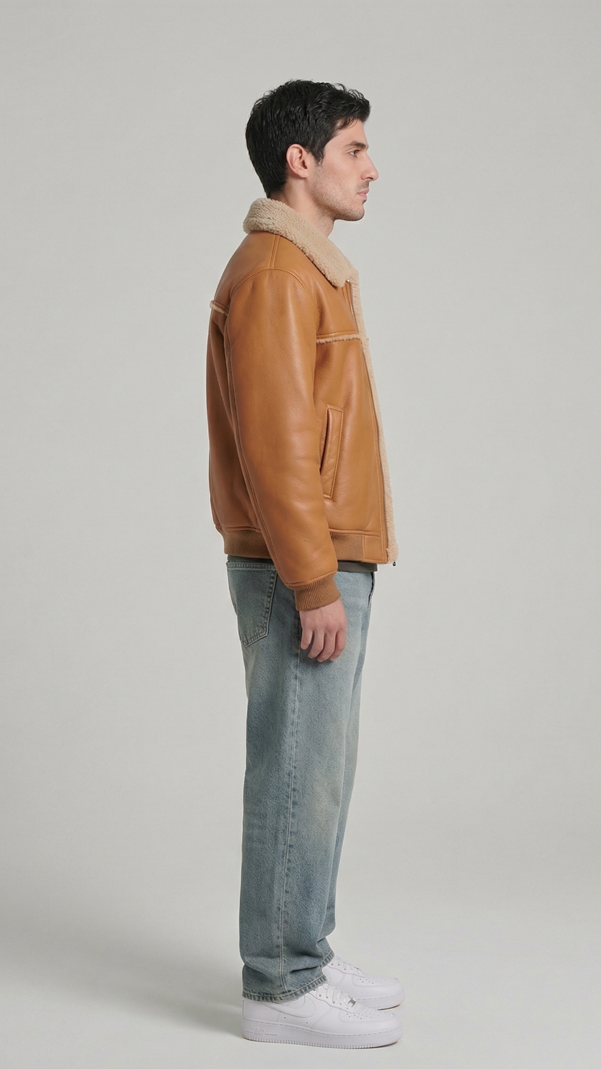 Warm winter sheepskin style jacket in light brown leather featuring cozy cream fur collar.