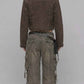 Back view of dark khaki denim Y2K jacket showing back yoke stitching and classic trucker coat seam details