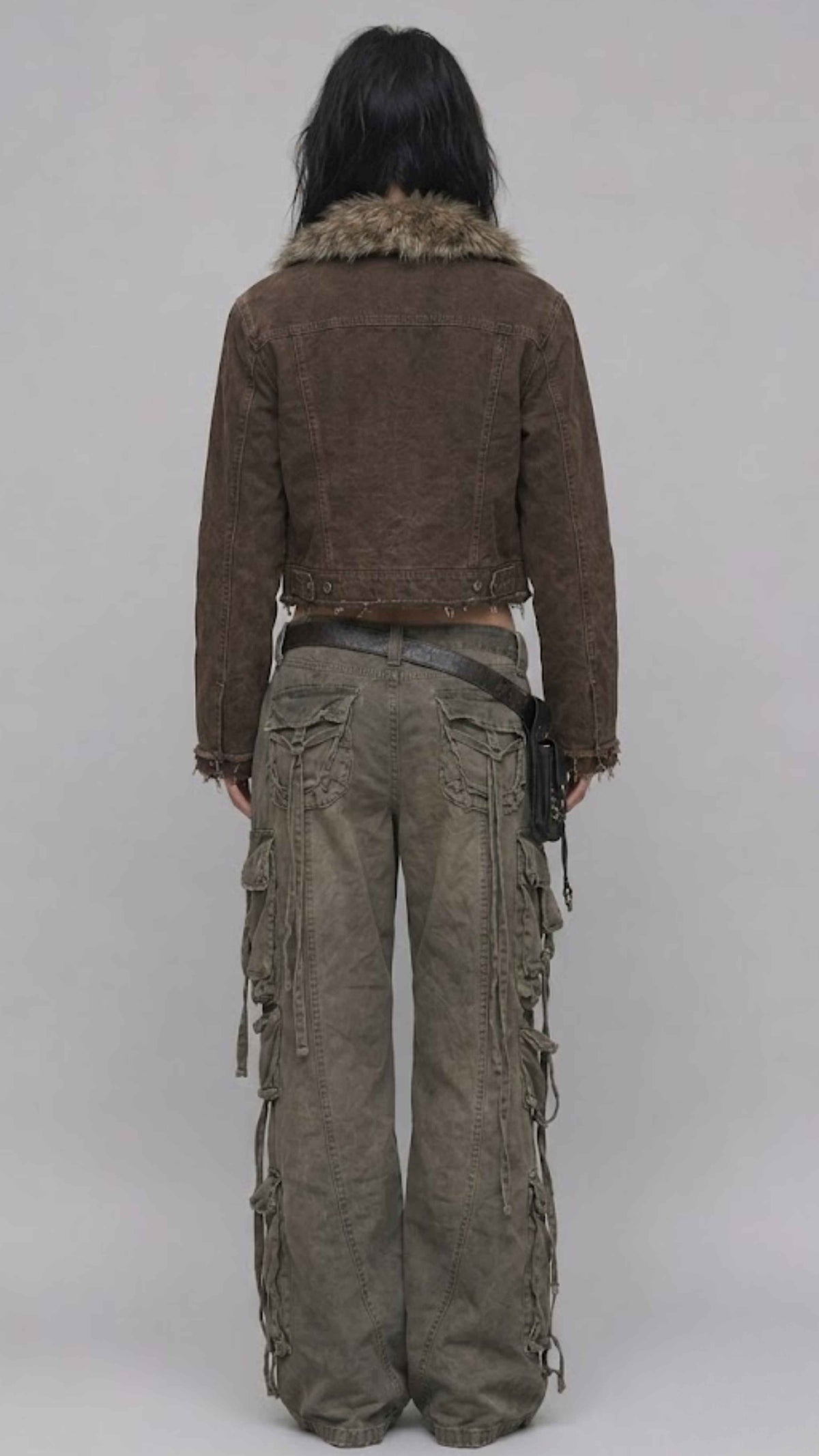 Back view of dark khaki denim Y2K jacket showing back yoke stitching and classic trucker coat seam details