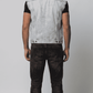 Sleek light wash denim sleeveless jacket designed for a modern urban street look and relaxed everyday wear.