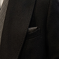 Stylish black winter outerwear featuring classic lapels and double-breasted design.