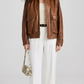 JACKERO women's cognac brown leather bomber jacket featuring drop shoulders and large dual flap front pockets.